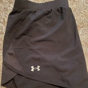 Under Armour women’s black shorts. Loose fit. Heat Gear. Worn once. NWT